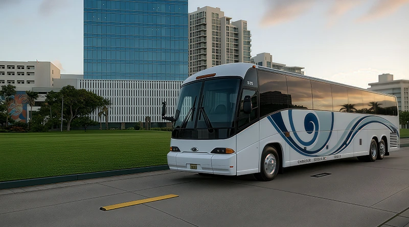 The photo of a JR Charter Services bus parked next to a historical site in Puerto Rico. Buildings can be seen in the distance.