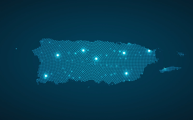 An abstract illustration of a map of Puerto Rico made using dots with different brightness levels over a dark blue background
